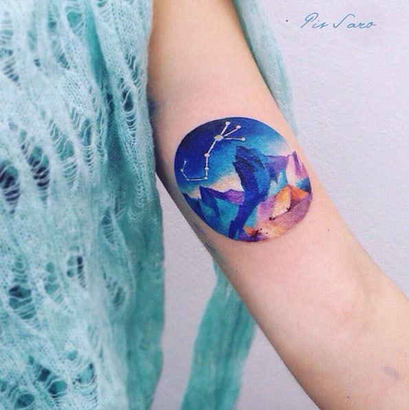Stunning watercolor mountain range tattoo by Pis Saro