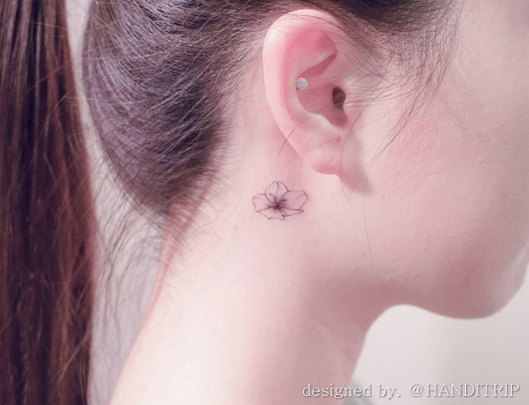 Behind-the-ear cherry blossom tattoo by Handitrip