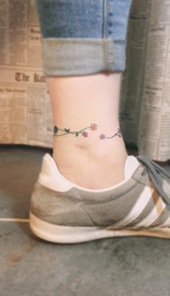 Flower anklet tattoo by Keizenith