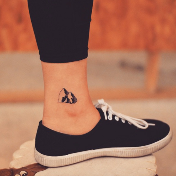 Tiny mountain tattoo on ankle by Tattooist Grain
