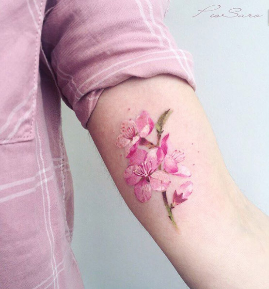Beautiful watercolor cherry blossom tattoo by Pis Saro