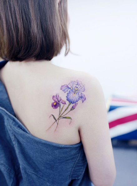 Purple iris on back shoulder by Tattooist Banul