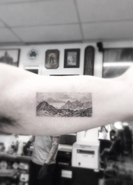 Single needle mountain landscape tattoo by Doctor Woo