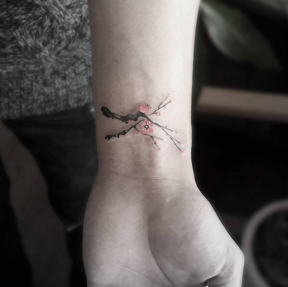 Cherry blossom wrist tattoo by Tattoo With Me