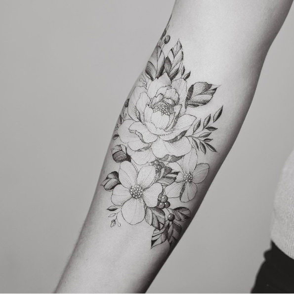 Beautiful floral forearm piece by Tritoan Ly