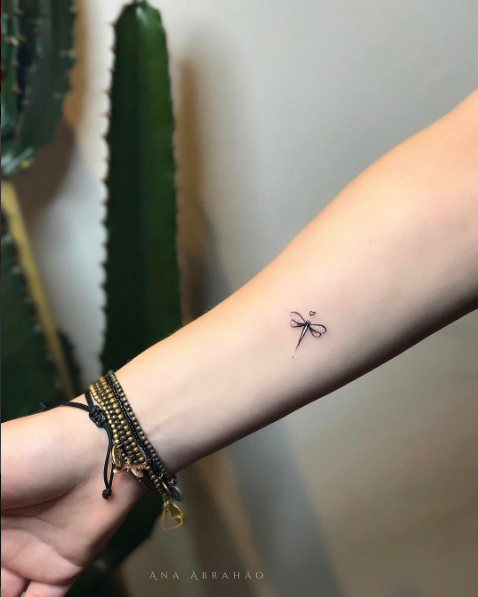 Little dragonfly tattoo by Ana Abrahao
