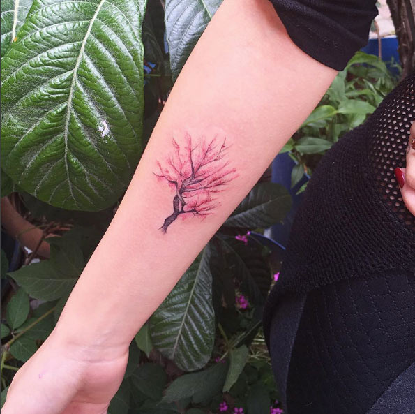 Cherry blossom tattoo on forearm by Fatih Odabas