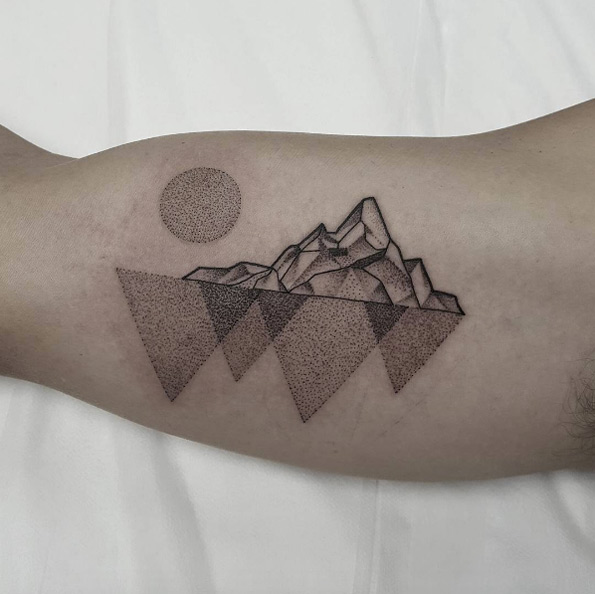Dotwork mountain range tattoo by Ben Doukakis