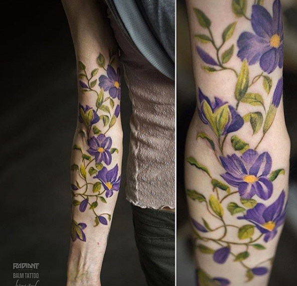 Sprawling floral piece on forearm by Andrey Lukovnikov