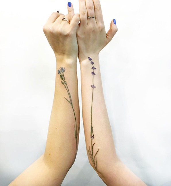Matching wildflower tattoos by Rita