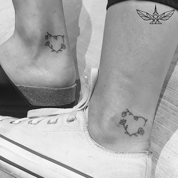 Matching floral hearts on ankle by Cholo