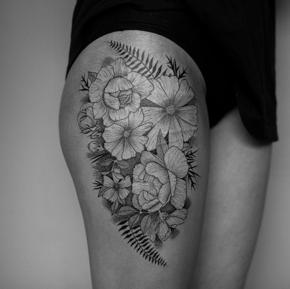 Black and grey ink floral thigh piece by Damo