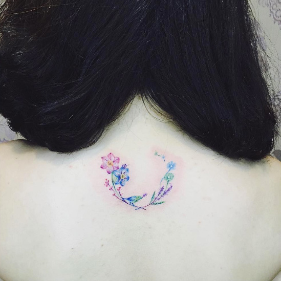 Cute floral tattoo by There Tattoo