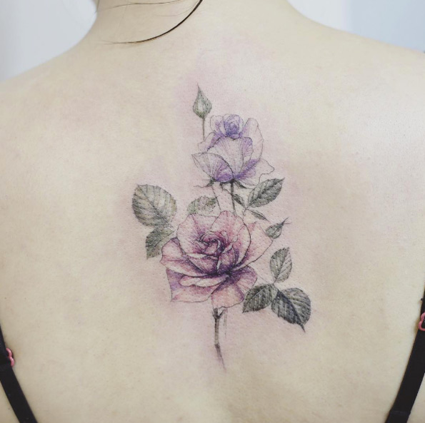 Elegant rose piece on back by Tattooist Flower