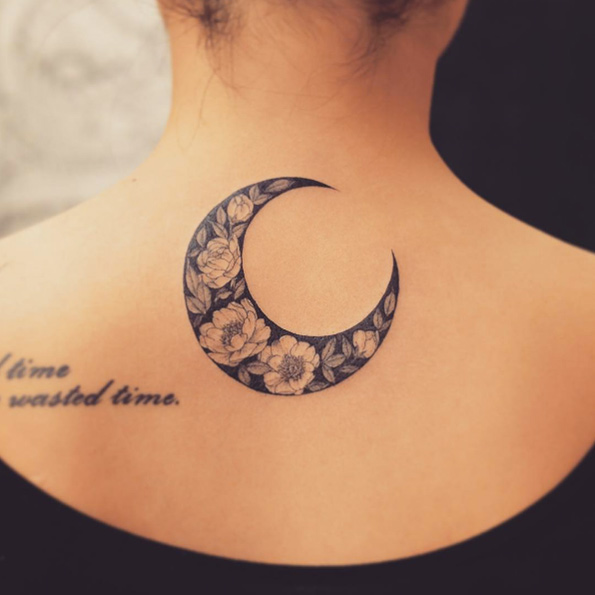 Floral crescent moon by Tattooist Grain