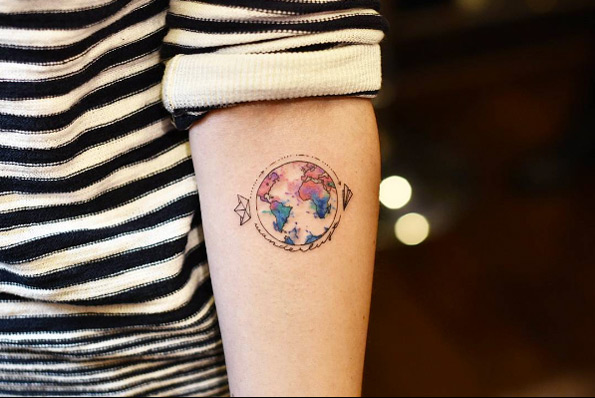 Cute globe tattoo by Drag Ink
