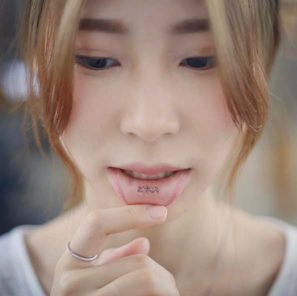 Lip tat by Tattooist Doy
