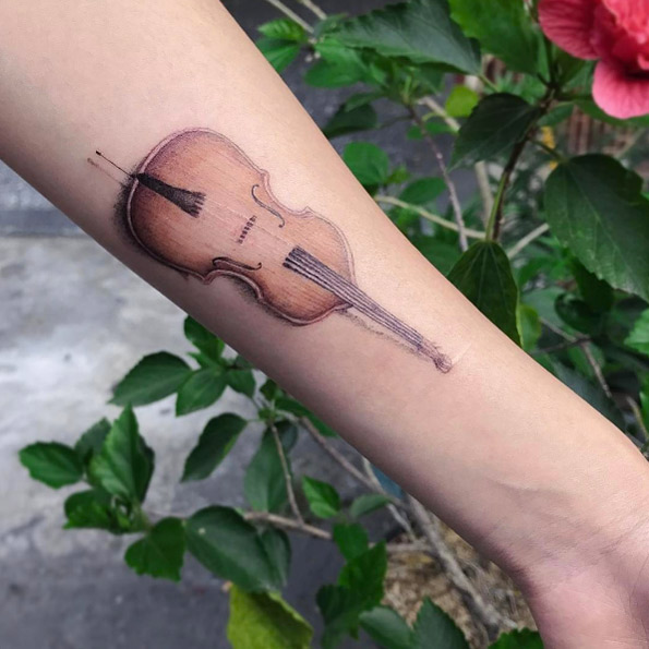 Cello tattoo by Mini Lau