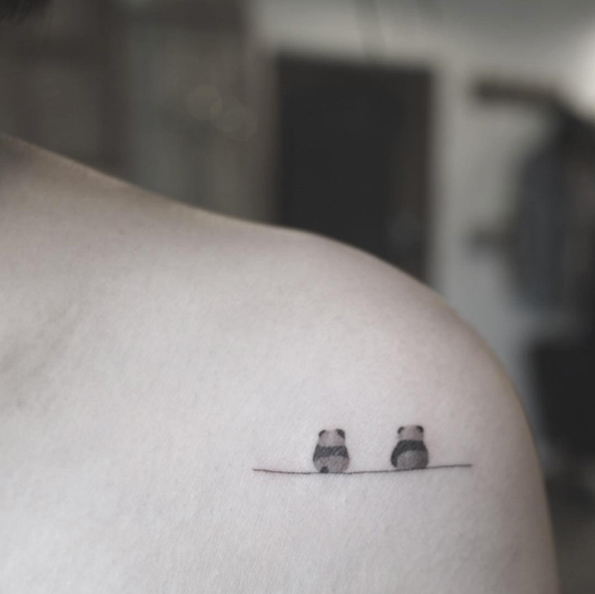 Two pandas by Tattooist Arar