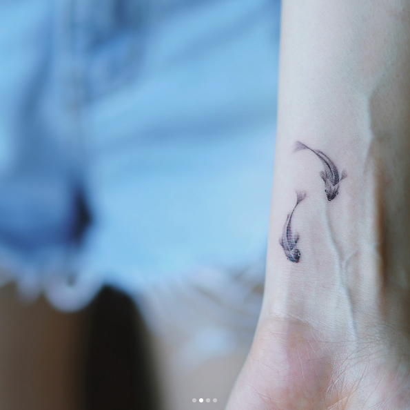 Wrist tattoo by Nando