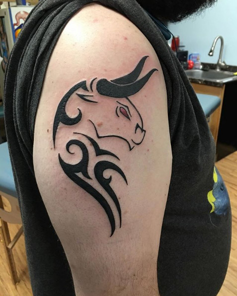 Taurus tribal bull tattoo by Hammett