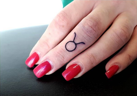 Taurus finger tat by Ver Tebra