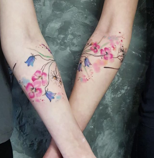 Matching sister tattoos by Simona Blanar