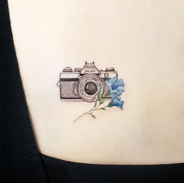 Camera and flowers by IDA