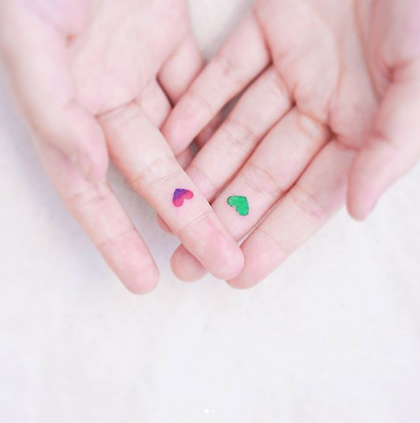 Colorful finger tattoos by Mini Lau