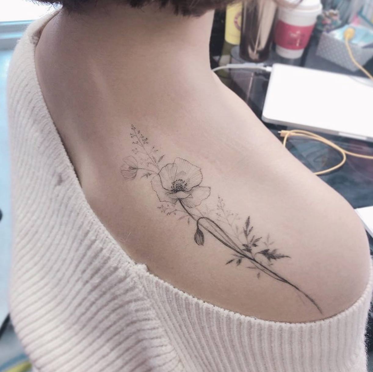 A floral back shoulder piece by Flower