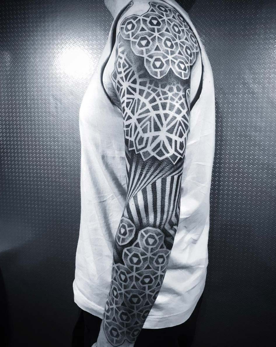 Geometric sleeve tattoo by Aleh Sanchez