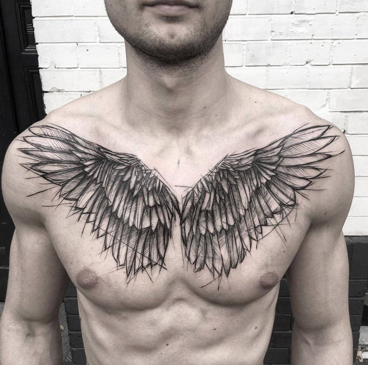 Sketch style wing tattoo by Kamil Mokot