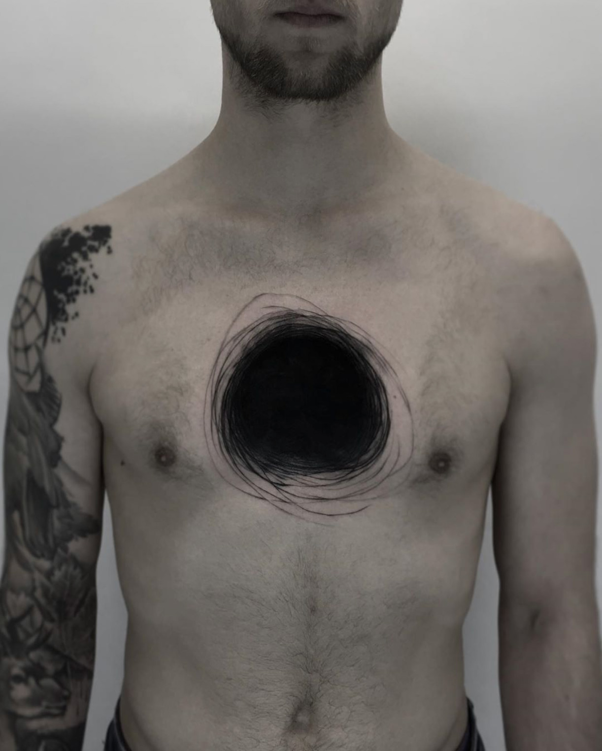 Black hole tattoo by Kamil Mokot